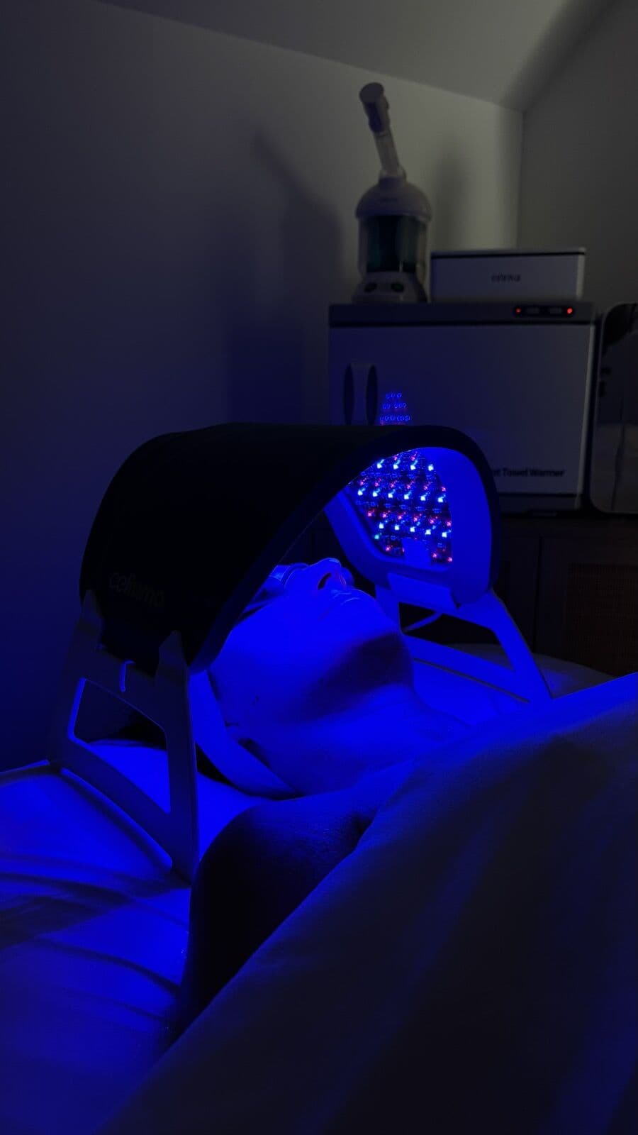 LED light therapy mask in a darkened room