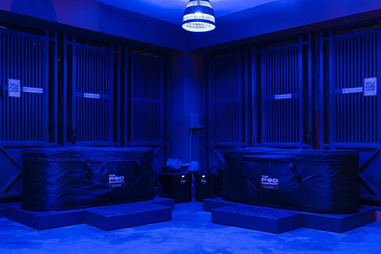 Cold plunge tubs under soft blue light
